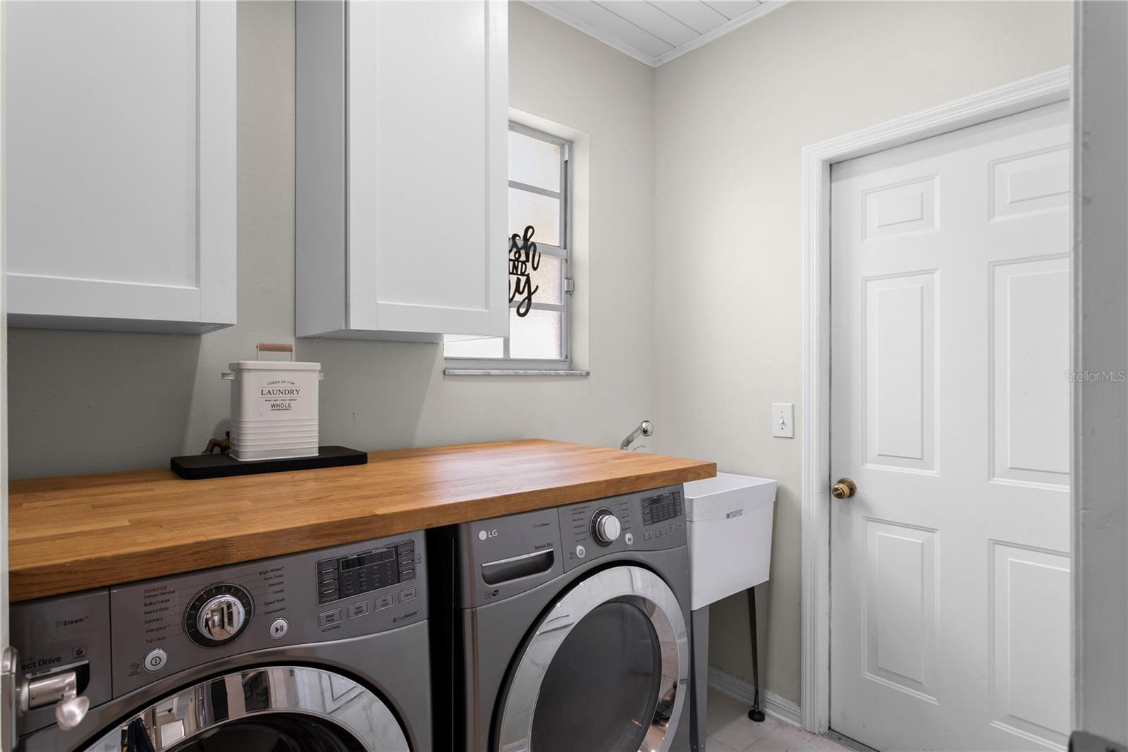 First floor laundry room with access to garage