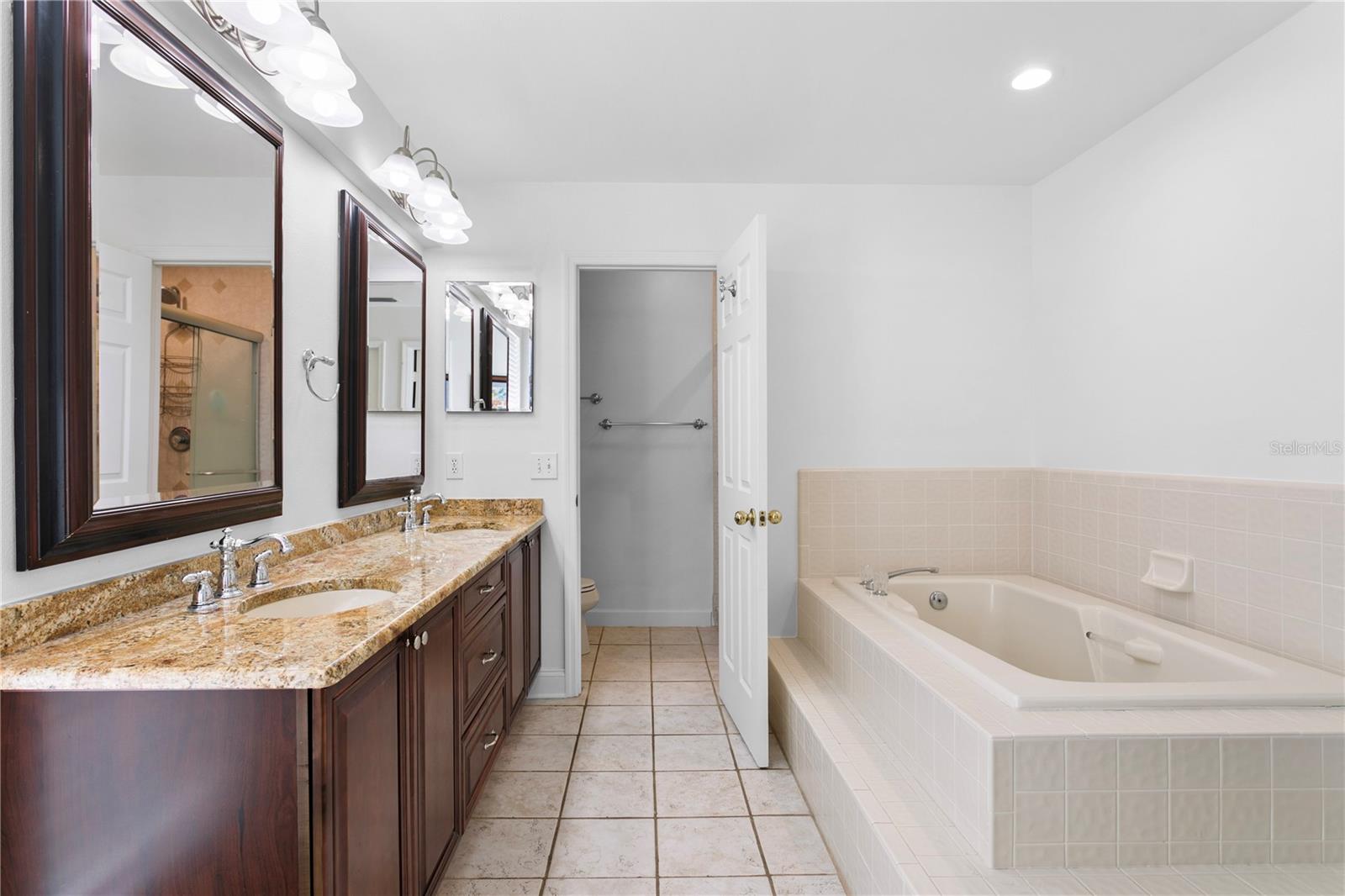 Primary bath features a garden tub