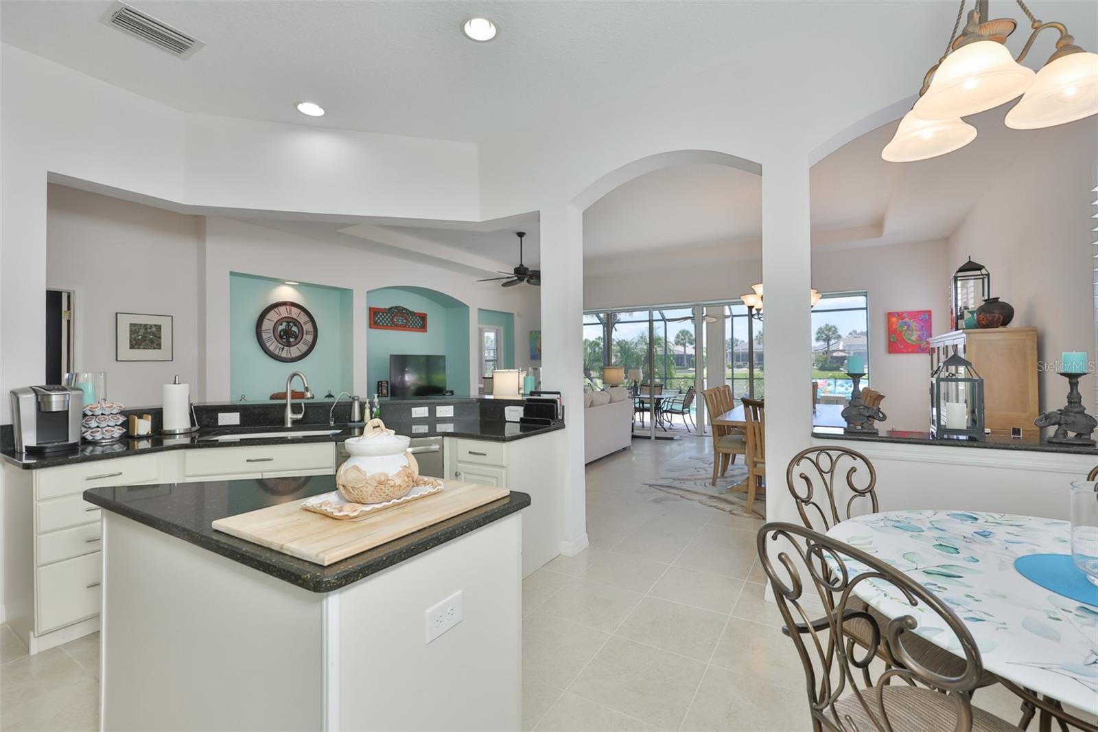 From the kitchen you have a perfect view of the lanai, the pool and the water.