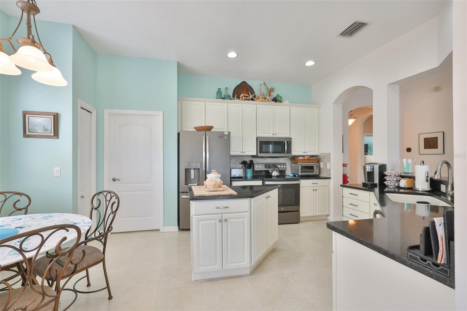 Kitchen is beautifully updated and spacious, with plenty of room for multiple cooks and an eat-in space.