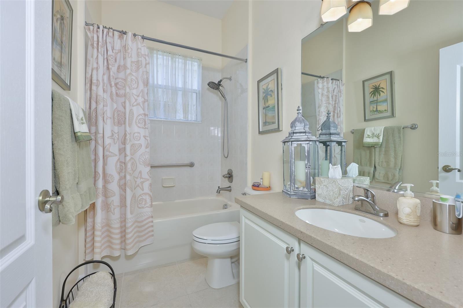 Guests Bathroom is nicely updated with neutral tones and ready for guests.