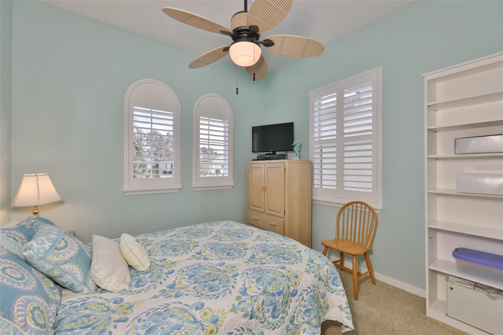 Multiple windows and plantations shutters make any guest feel special.