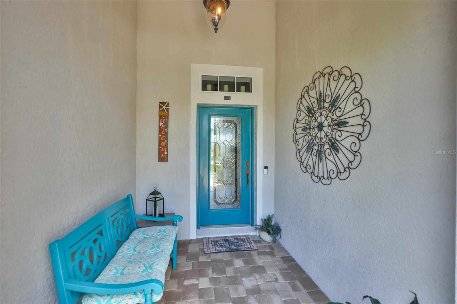 Screened front porch so that you and guests are out of the elements with more security for your packages and deliveries.