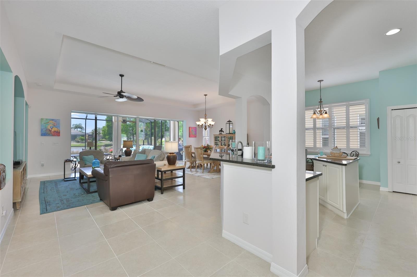 As you walk in, the open floor plan and stunning outdoor scenery, invite you in.