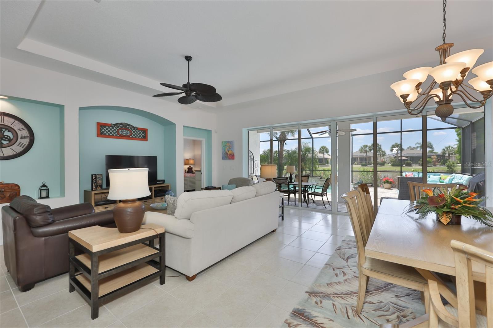 Cool tile floors, telescoping glass doors and 'Sea Breeze' paint tones, makes this home feel as if you are in a resort.