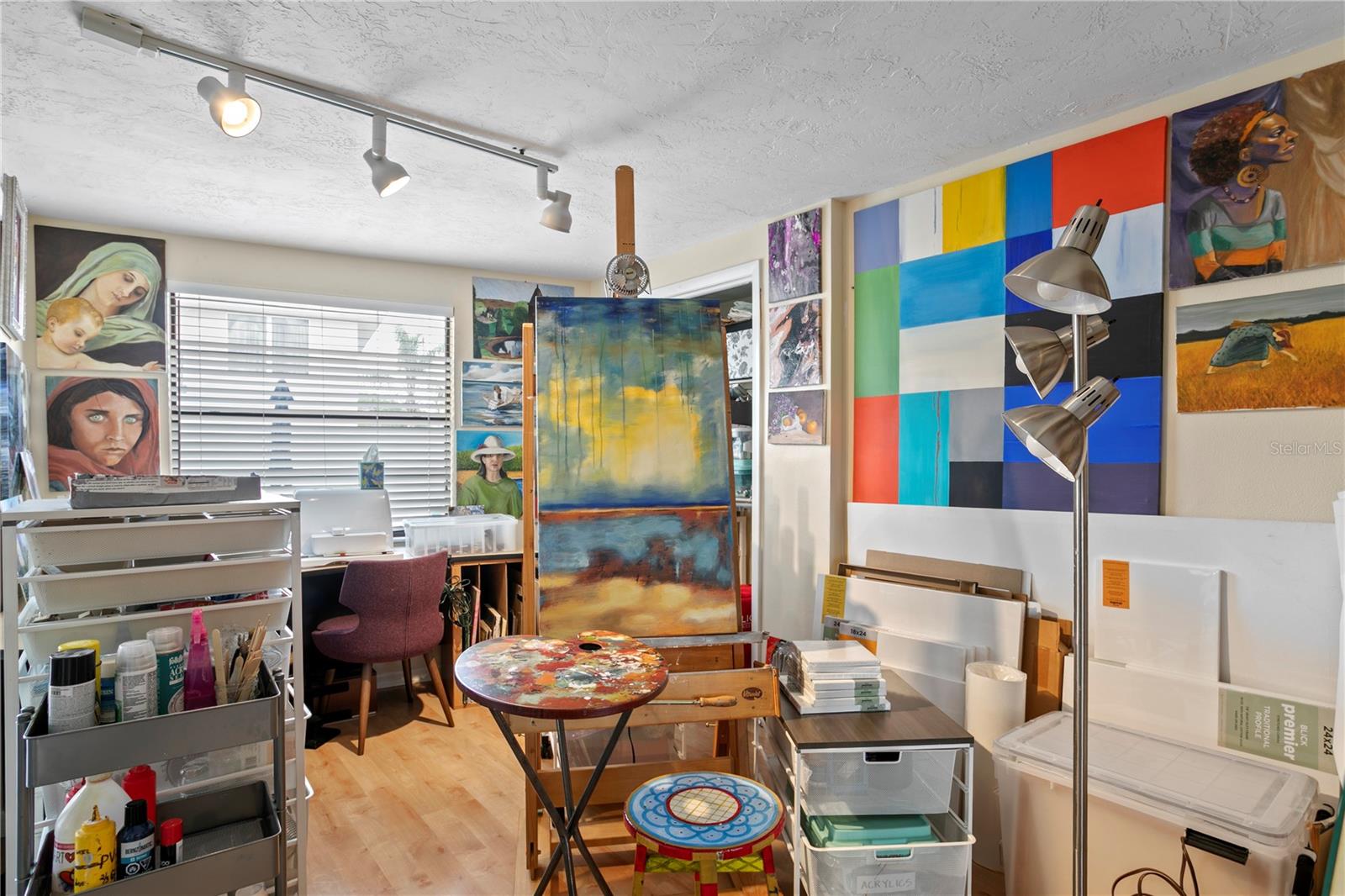 Office adjacent to primary bedroom, currently used as an artist's studio.