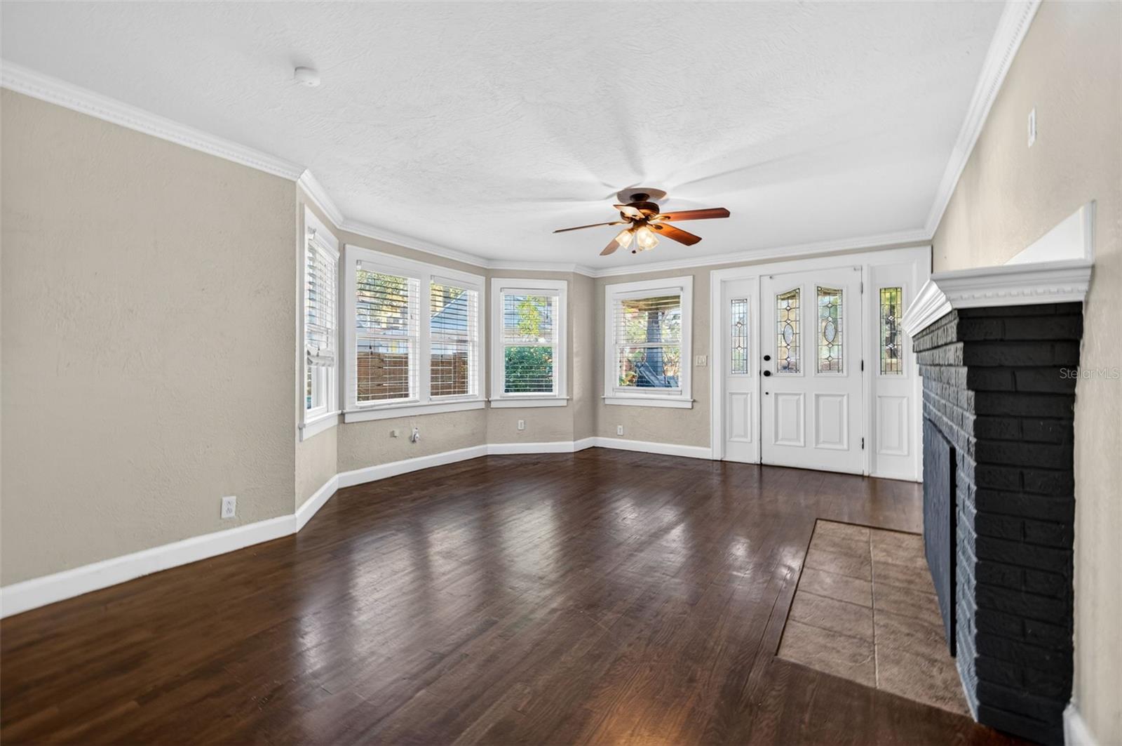 Rich dark hardwood floors throughout.