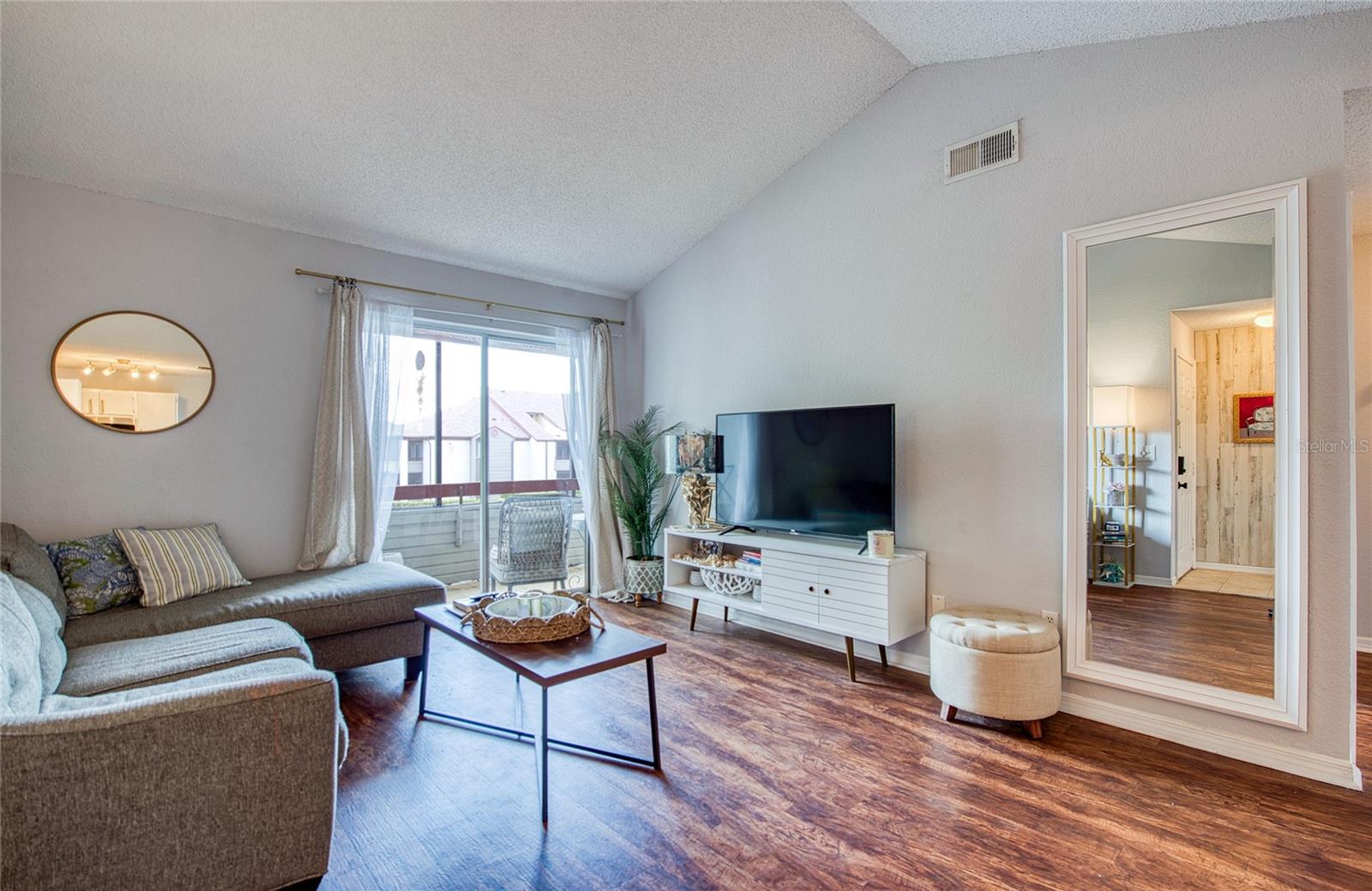 Vaulted Ceilings w/ Balcony Access from Living Area