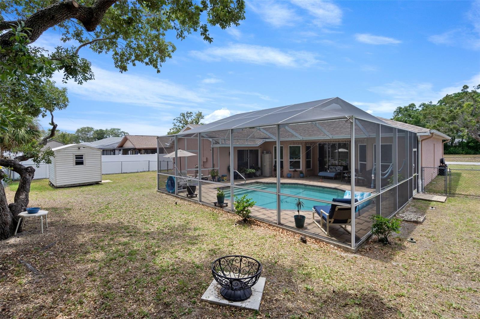 Left Side of Backyard & Pool Cage