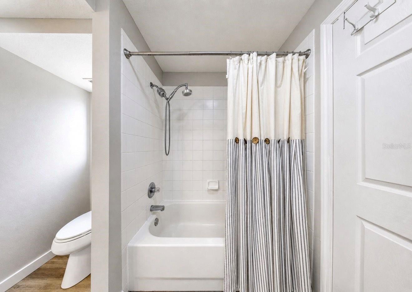 Primary suite bathroom and walk in closet.