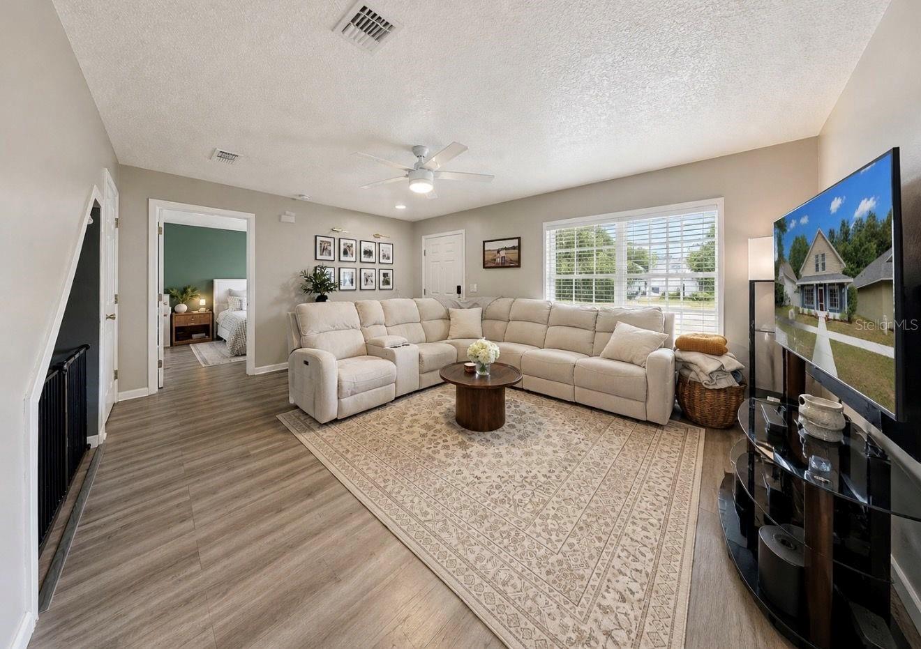 Living room. Entrance to Primary Suite.