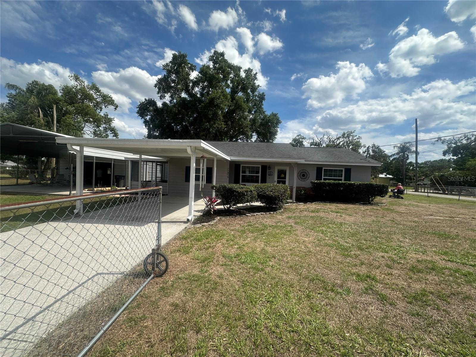 Front of house with carport 1