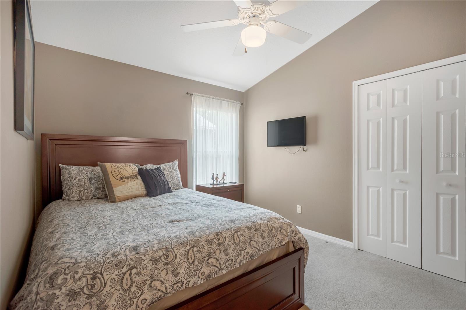 Two secondary bedrooms are in the middle of the home and share a guest bath.