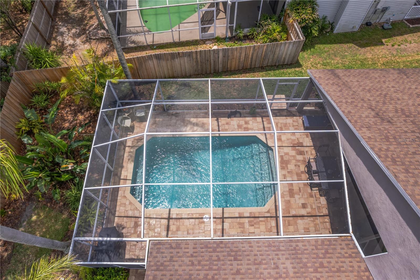 Buyers will relax beneath the covered and screened lanai and enjoy sunny afternoons by the shimmering pool.