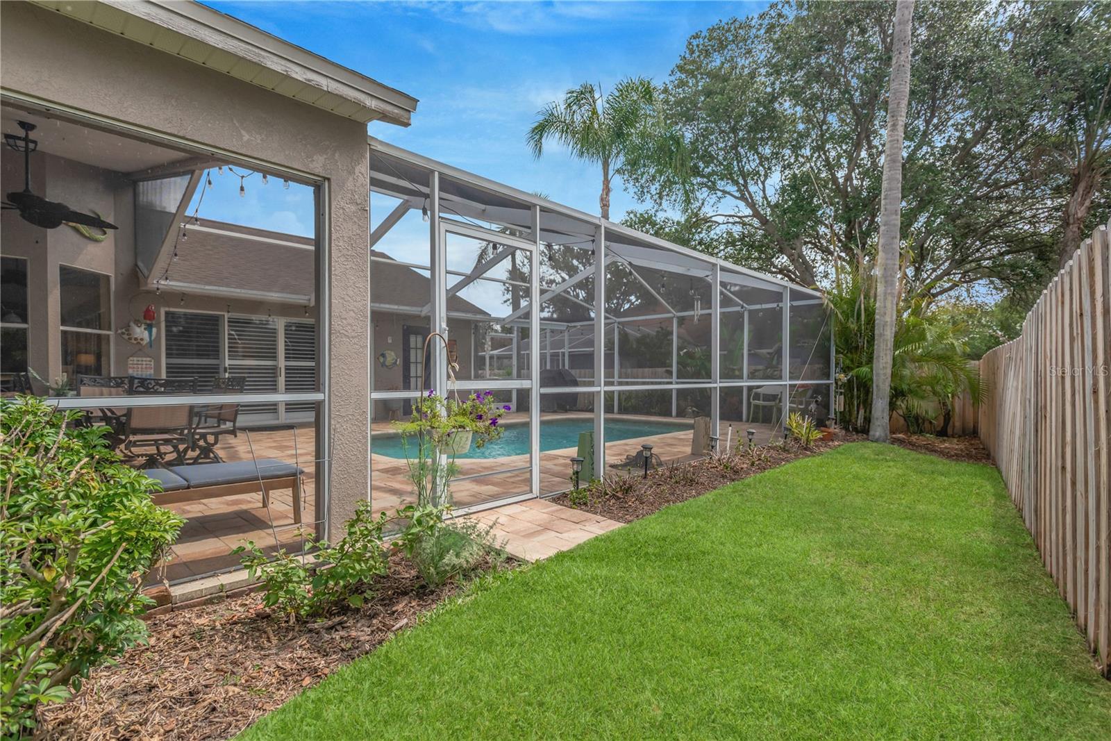 Outside, your private backyard oasis awaits.  Yard re-sodded in 2025.