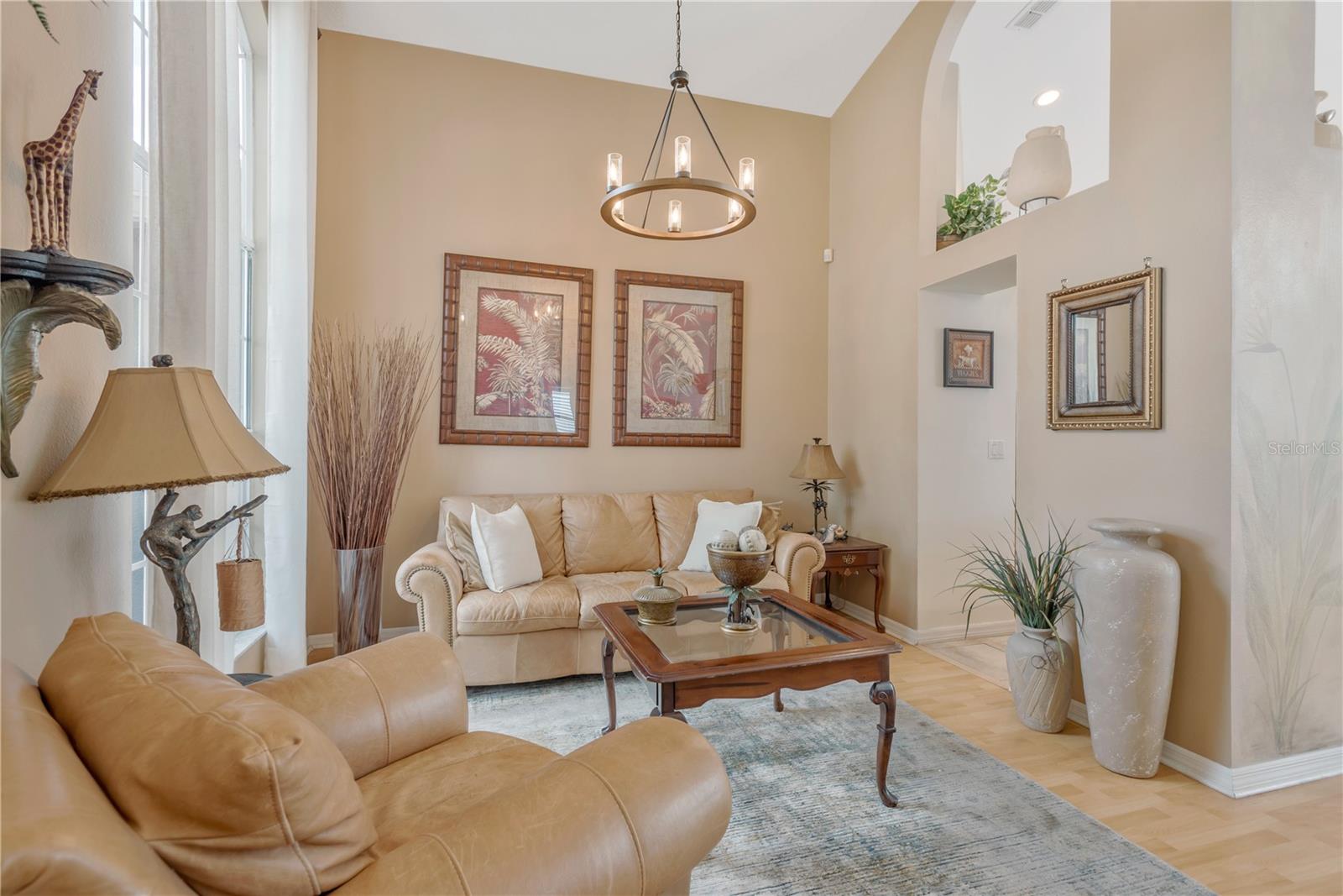 Just inside the front door is a formal living/dining room with soaring ceilings.
