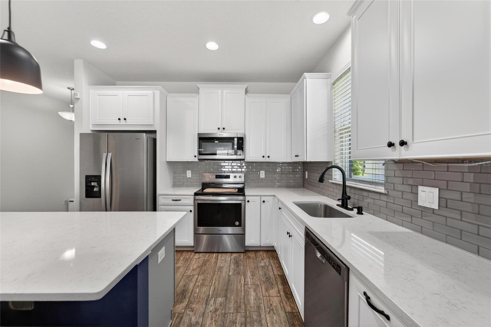 Bright and functional kitchen with plenty of prep and storage space.