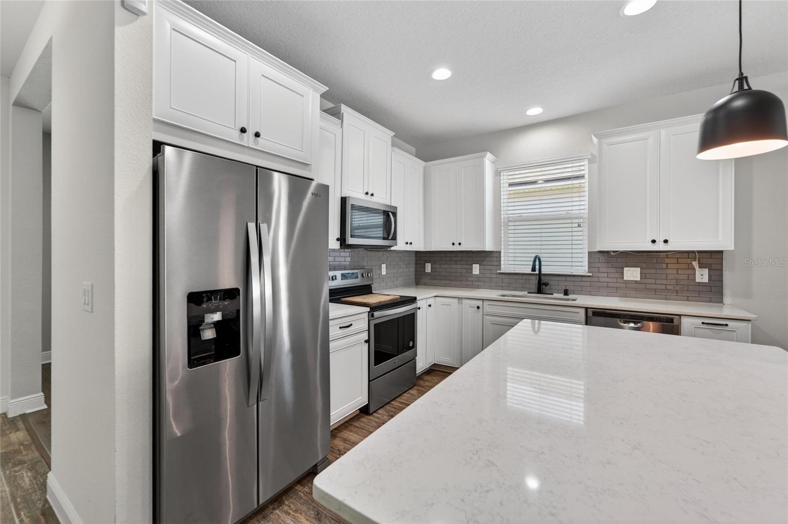 Spacious counters and ample storage make cooking a pleasure.