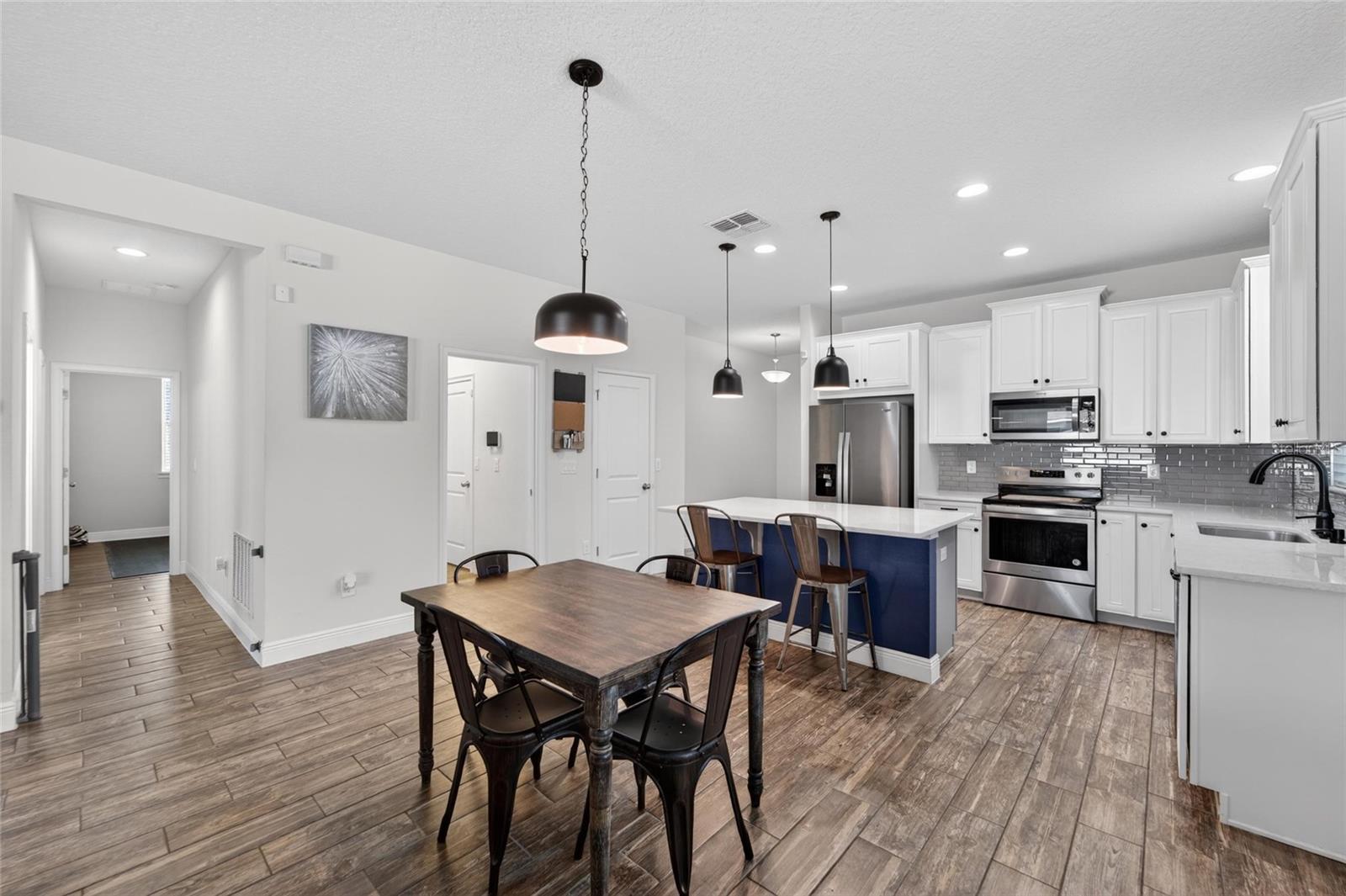 Open-concept kitchen and dinette create an inviting atmosphere.