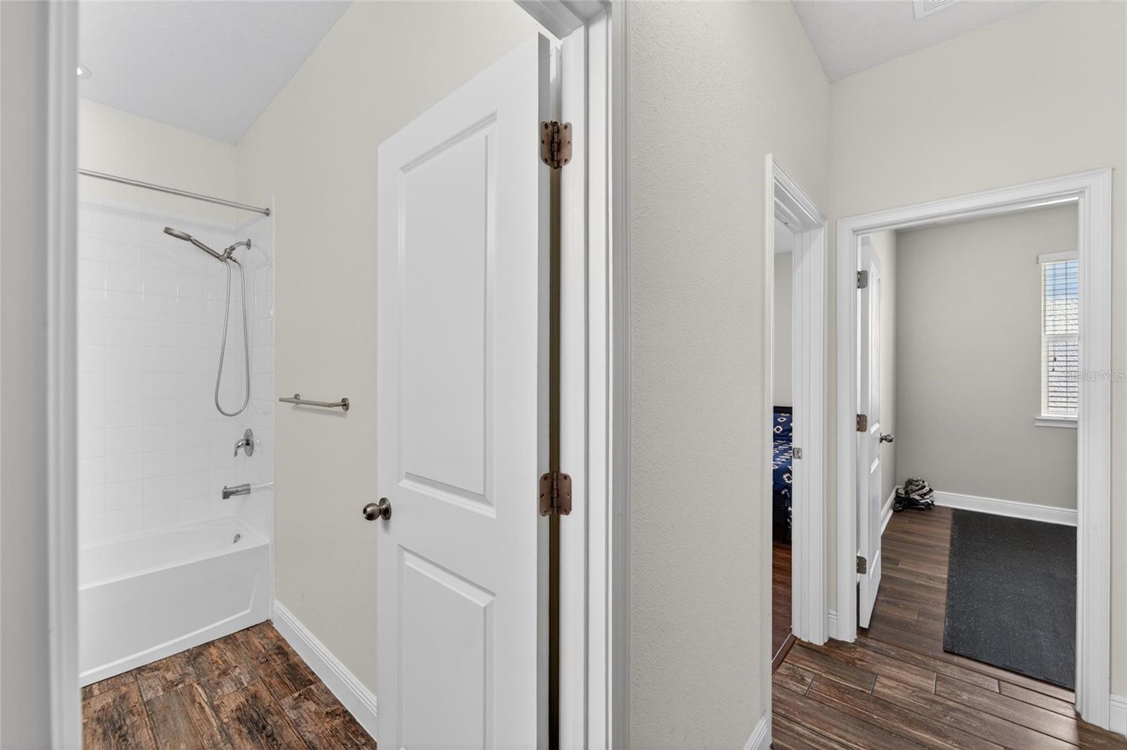 Functional full bath perfectly positioned for guests and secondary bedrooms.