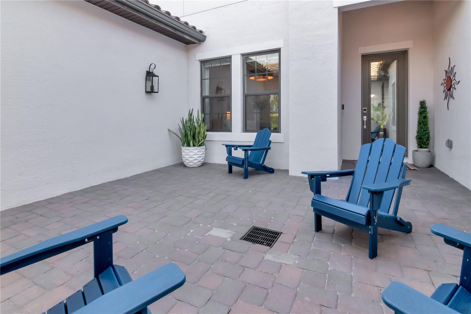 Unique and elegant courtyard entry. Offers additional security and privacy but also great for entertaining.