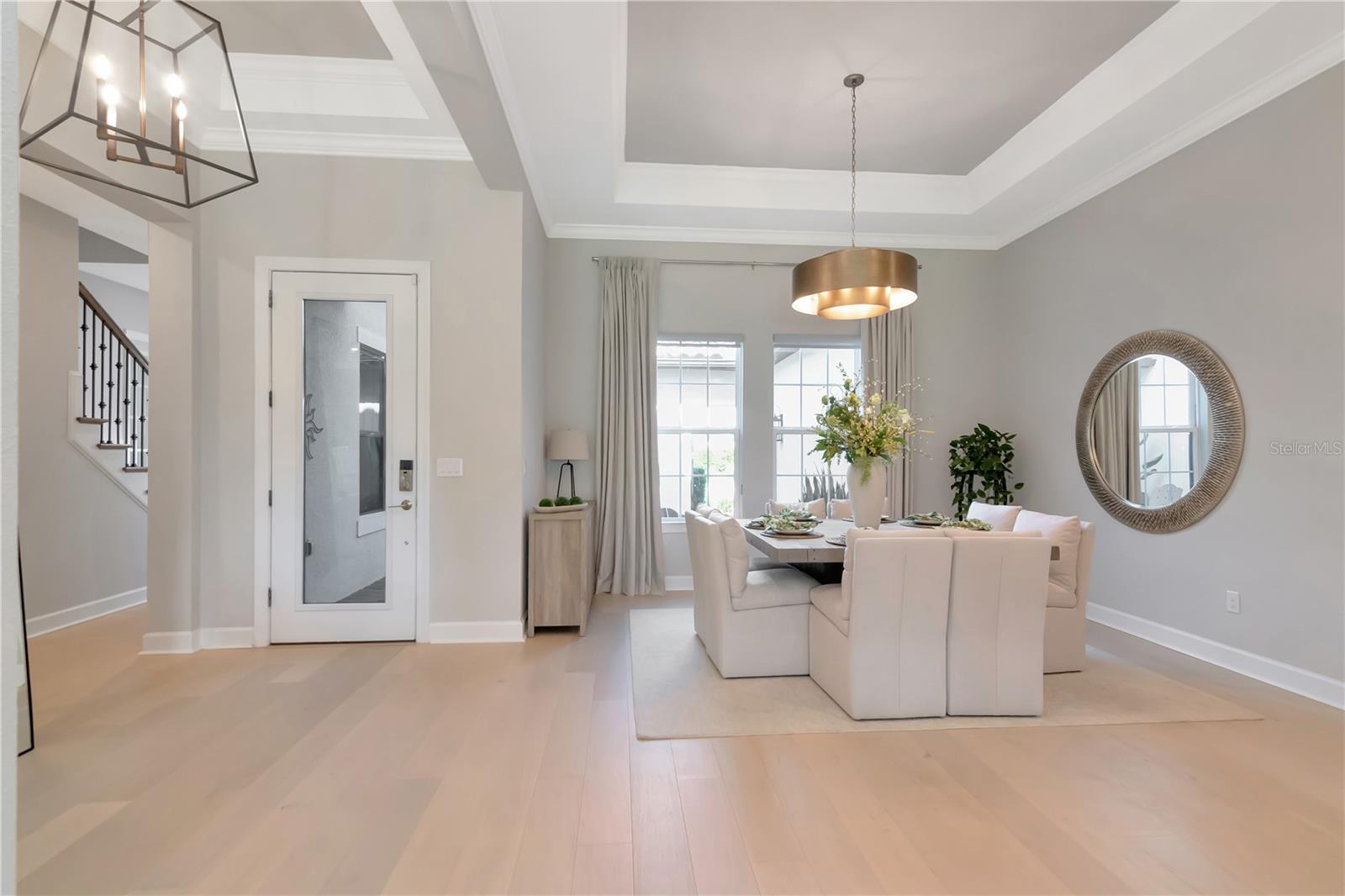 Open Entryway with Tray Ceilings and flooded with Natural Light