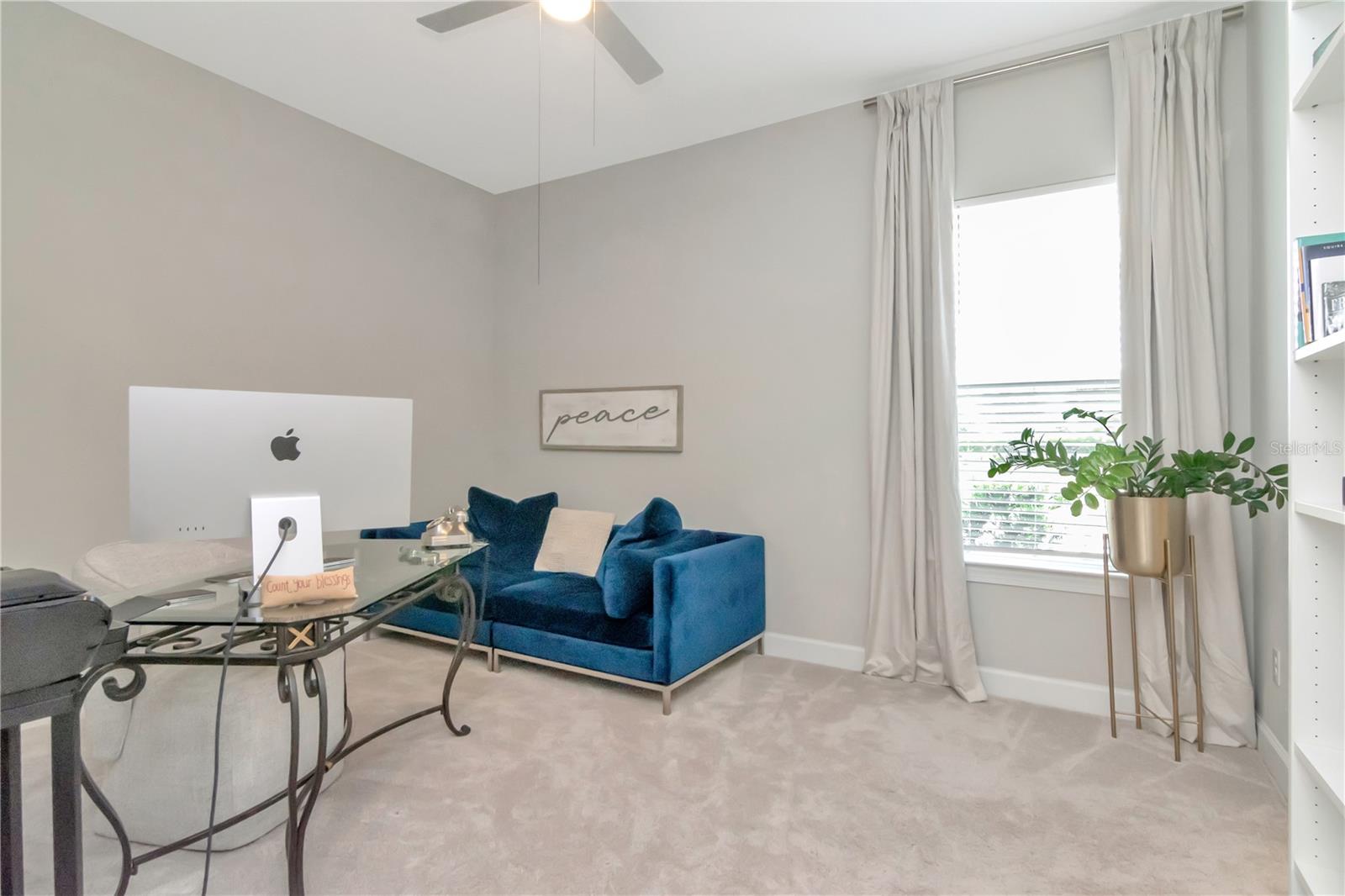 Bedroom 3 with shared Bathroom featuring private, dual vanities.