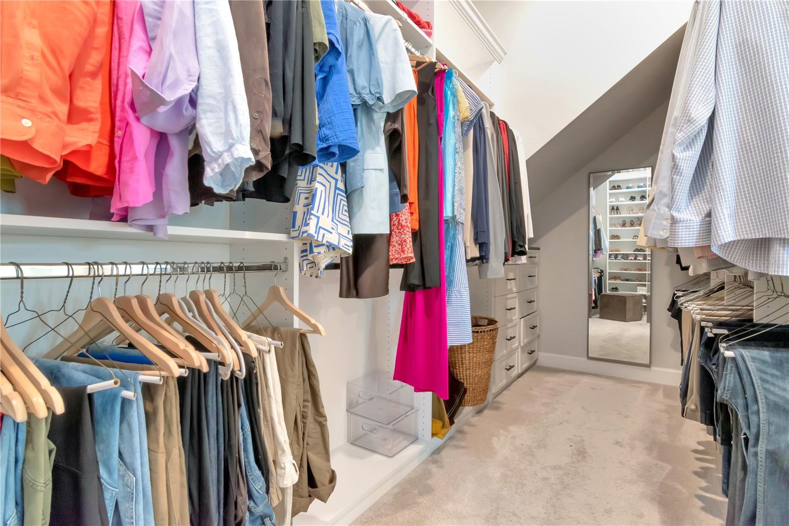 Large, custom walk in Primary Closet with built ins.