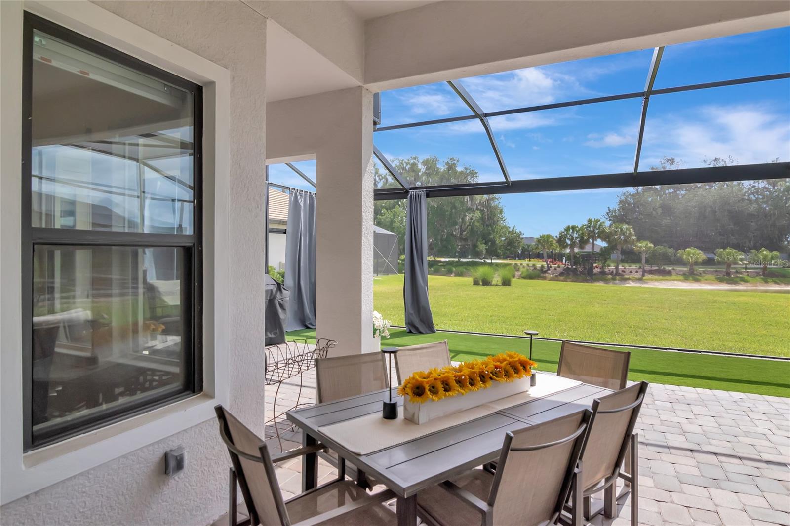 Extended Lanai - Complete with panoramic screen, artificial turf, ceiling fan.
