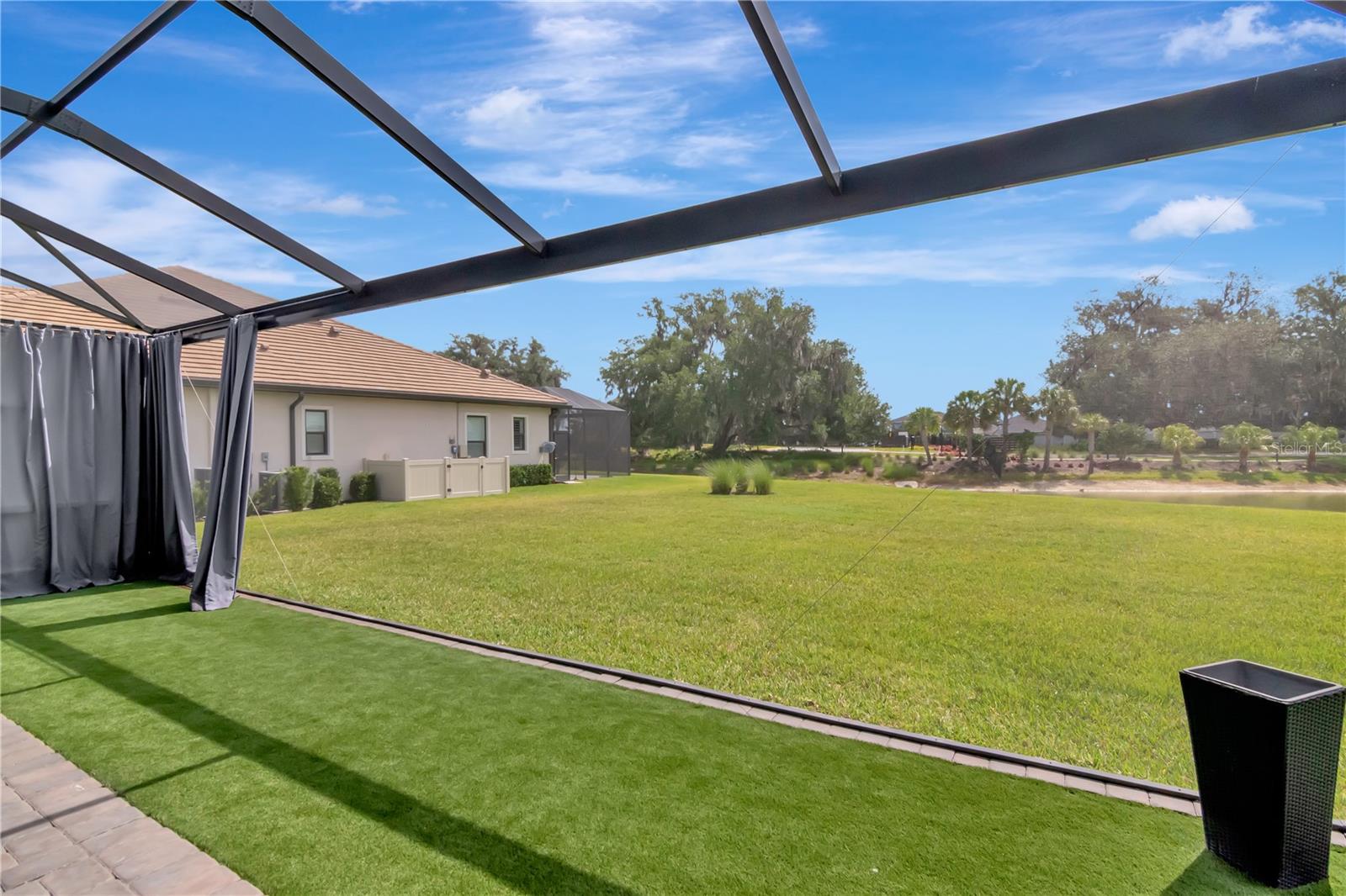 Extended Lanai - Complete with panoramic screen, artificial turf, ceiling fan.