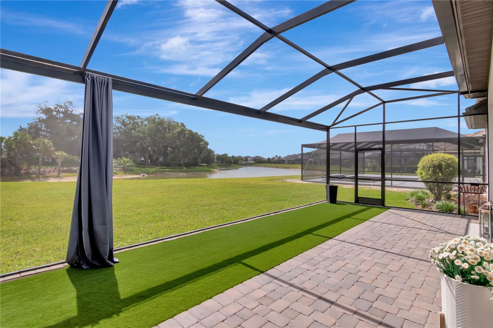 Extended Lanai - Complete with panoramic screen, artificial turf, ceiling fan.