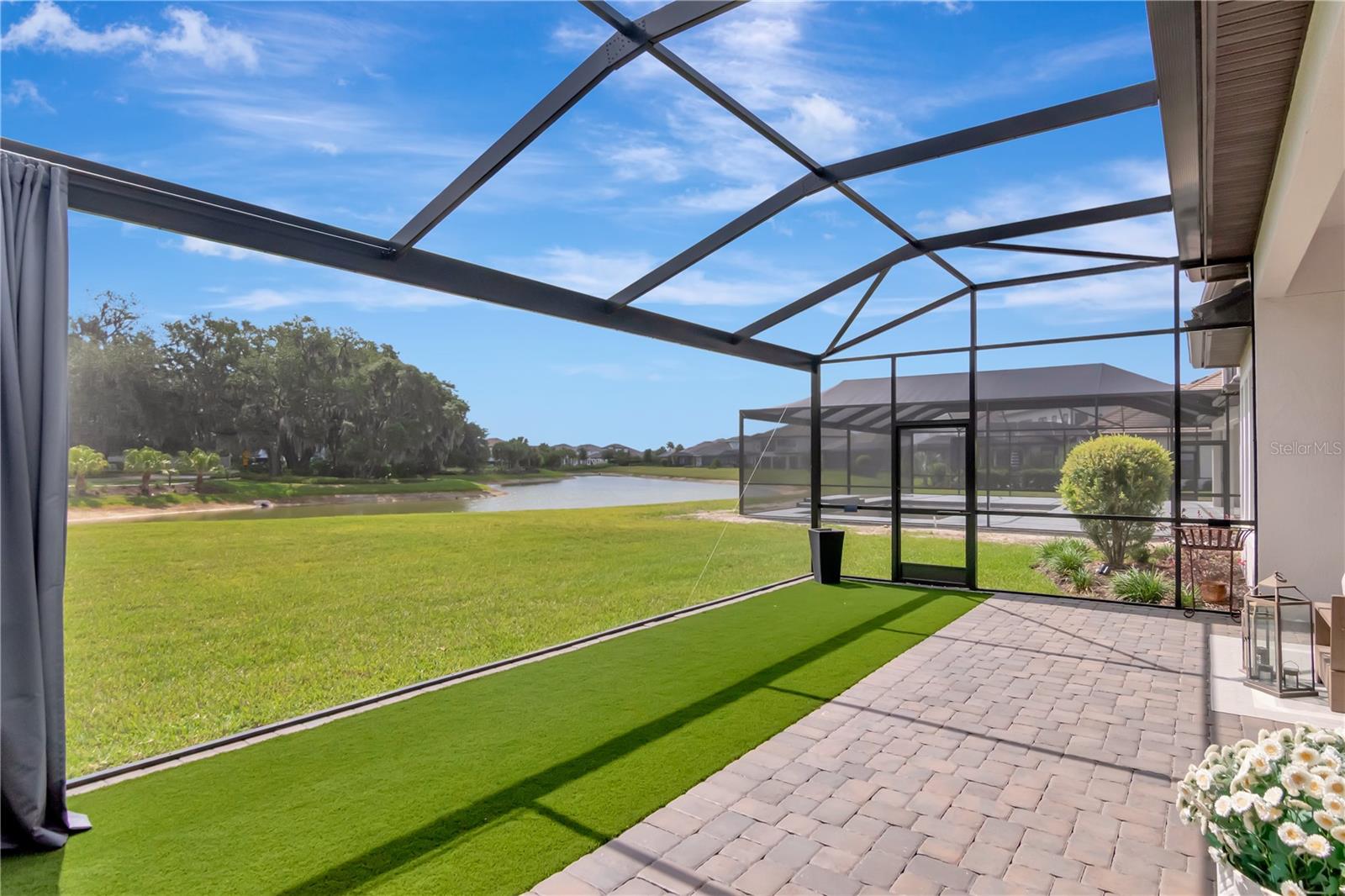 Extended Lanai - Complete with panoramic screen, artificial turf, ceiling fan.