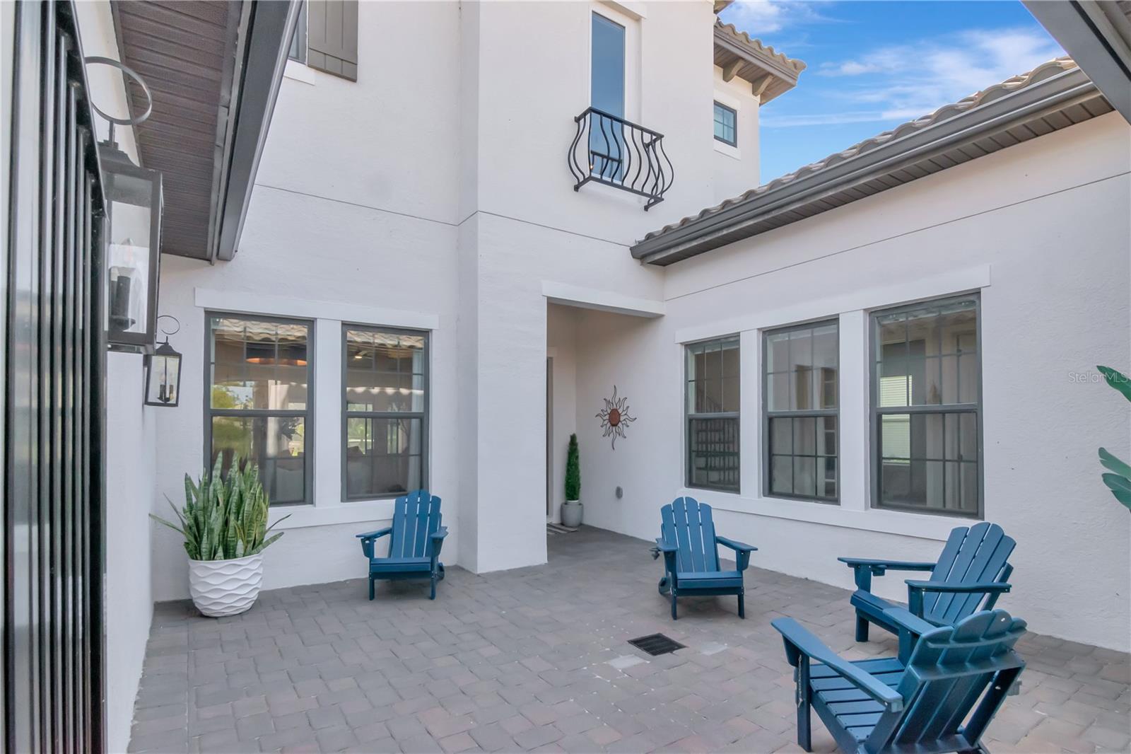 Unique and elegant courtyard entry. Offers additional security and privacy but also great for entertaining.