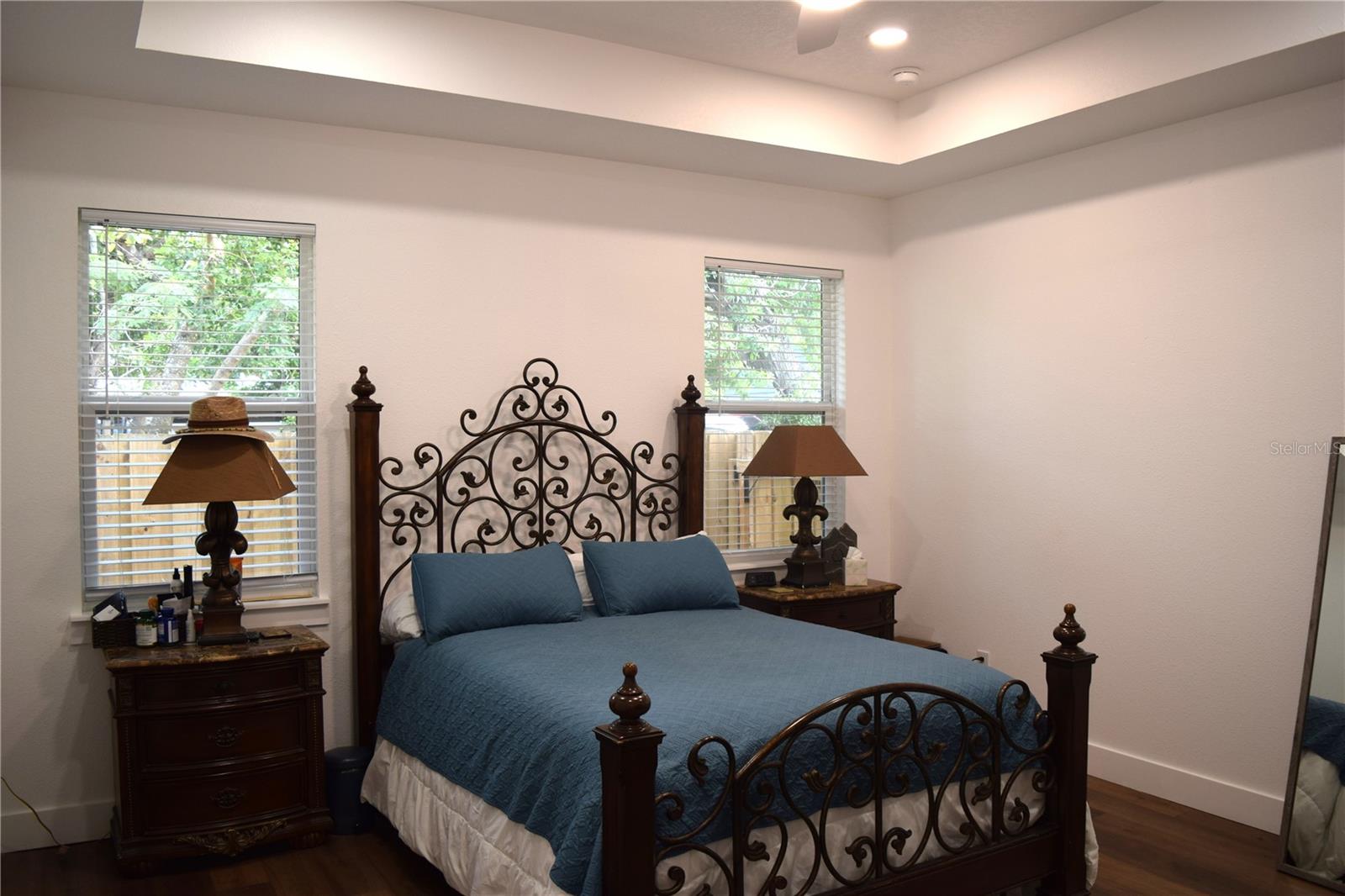 The Primary Bedroom has tall ceilings, LED recessed lighting and a ceiling fan