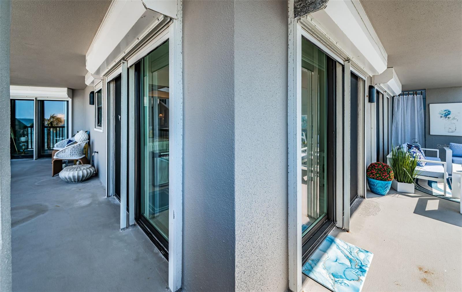 The balcony stretches around to connect the second bedroom with access and additional storage for your beach things!