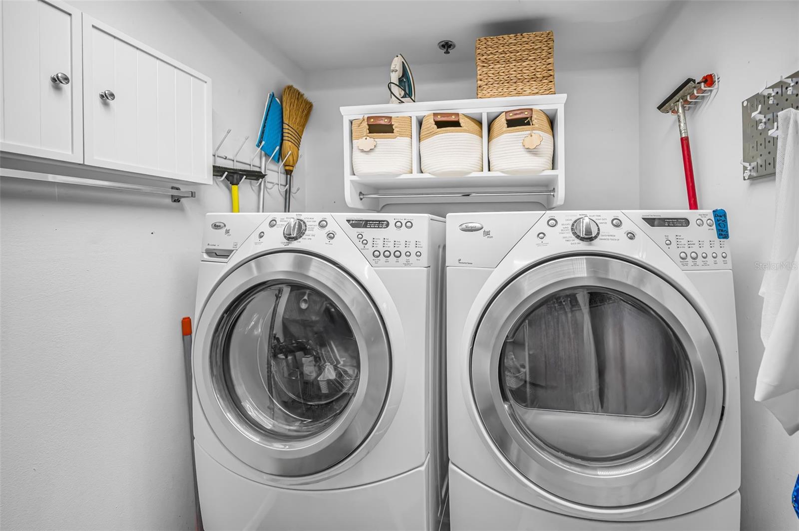 Inside Utility room with full sized washer & dryer