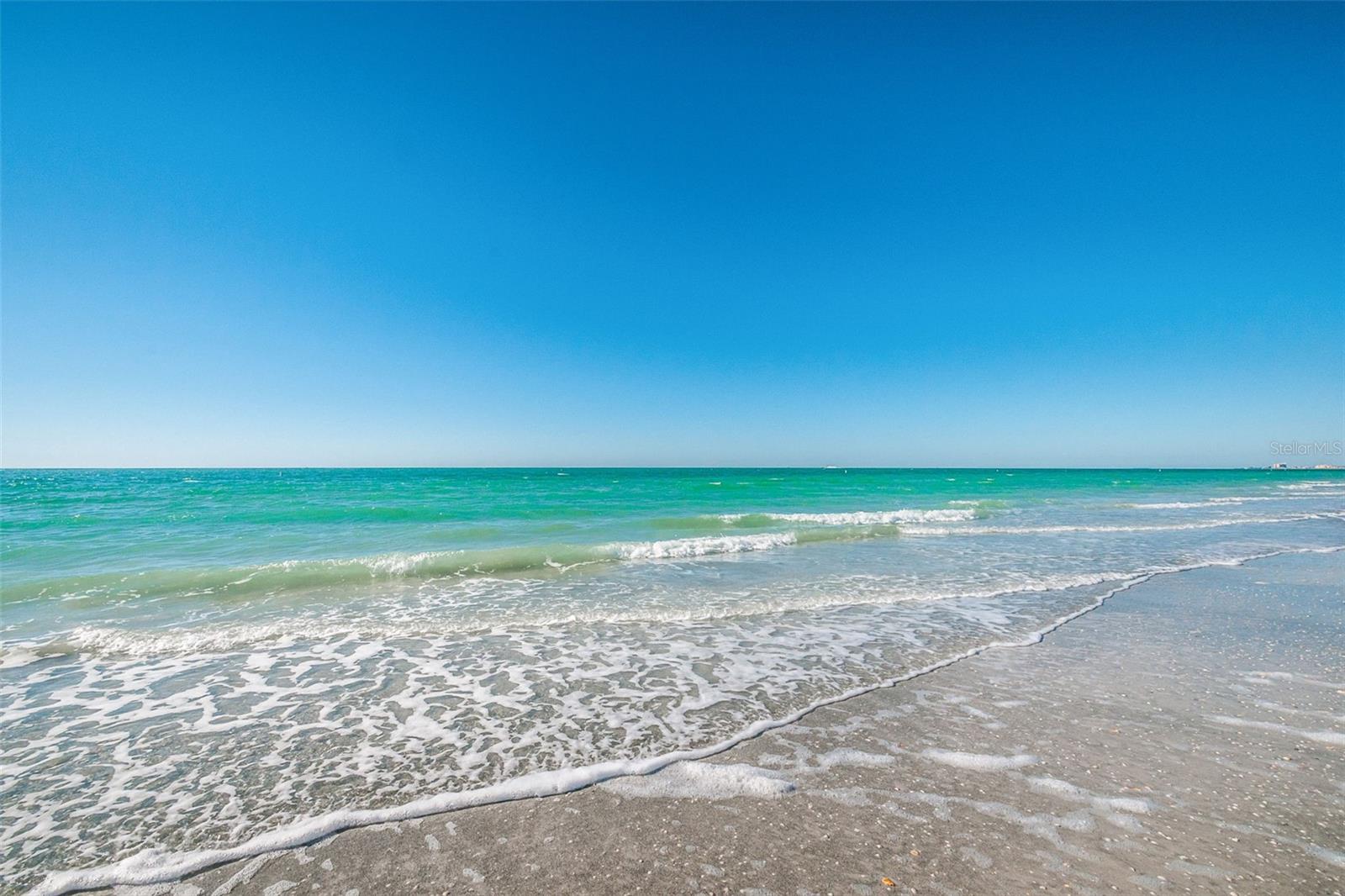 The sugary sands of Sand Key Beach directly in front of your unit!