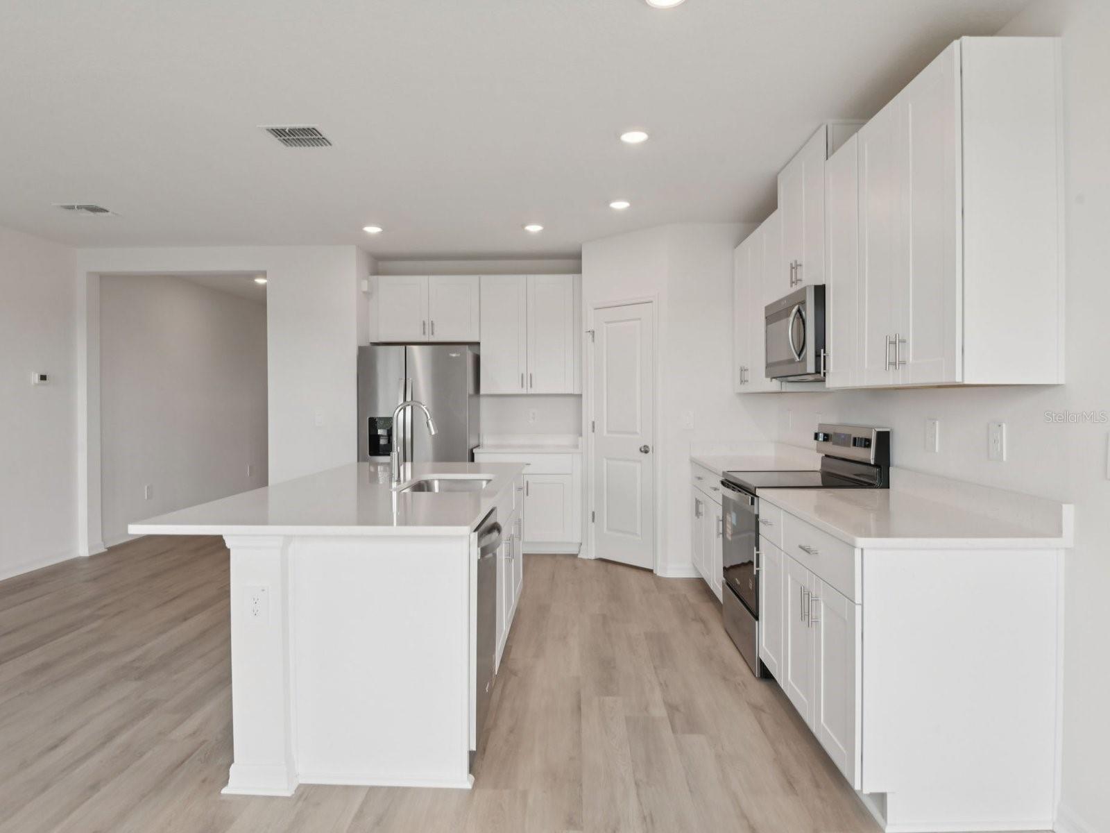 Interior photos are not of the actual home but are photos of the builder home with the same floorplan with similar interior finishes and features.