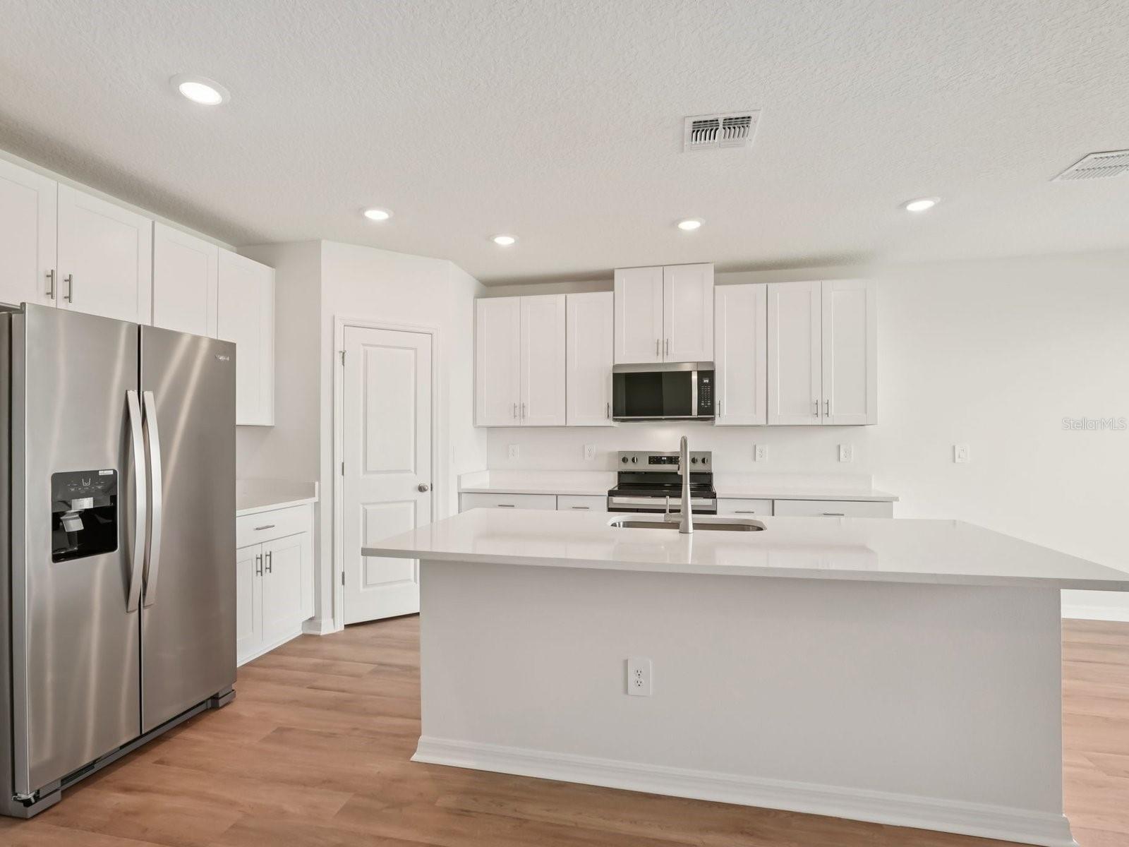 Interior photos are not of the actual home but are photos of the builder home with the same floorplan with similar interior finishes and features.