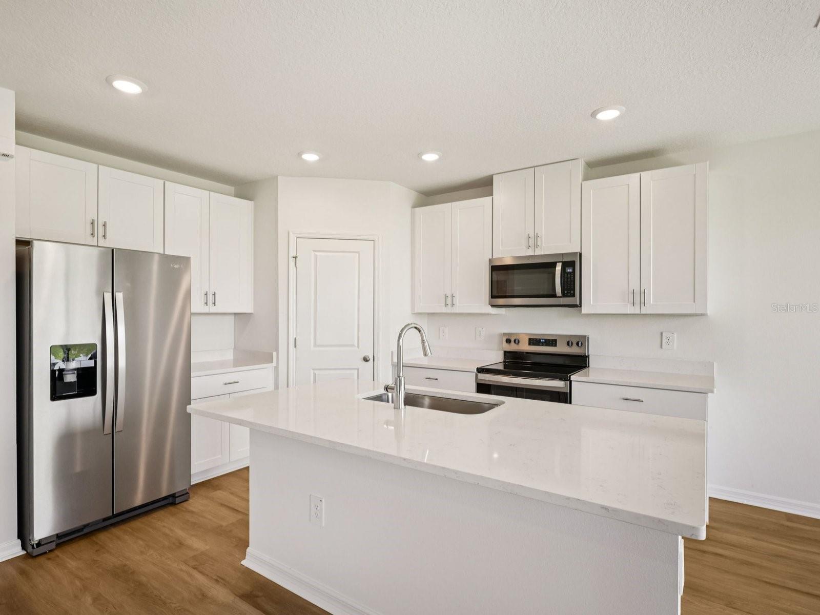 Interior photos are not of the actual home but are photos of the builder home with the same floorplan with similar interior finishes and features.
