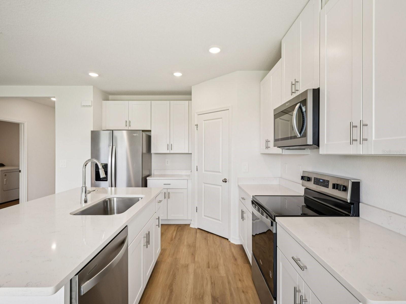 Interior photos are not of the actual home but are photos of the builder home with the same floorplan with similar interior finishes and features.