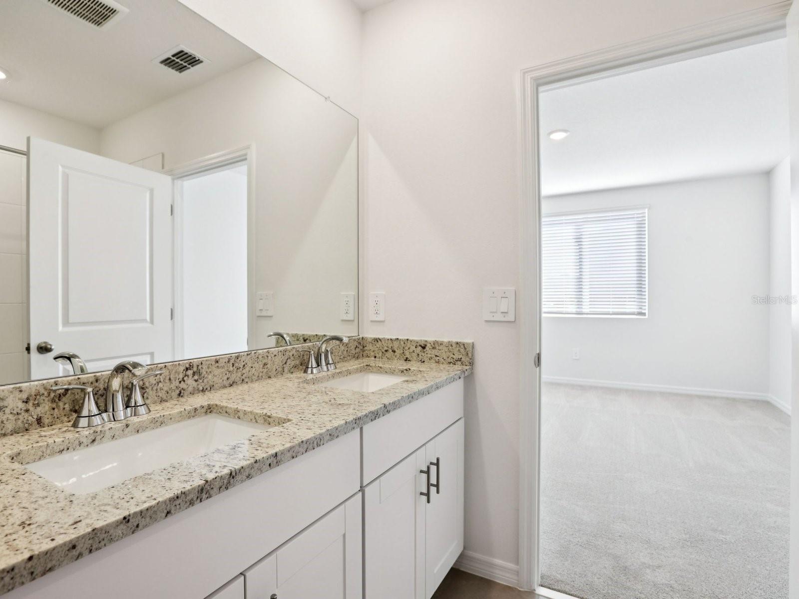 Interior photos are not of the actual home but are photos of the builder home with the same floorplan with similar interior finishes and features.