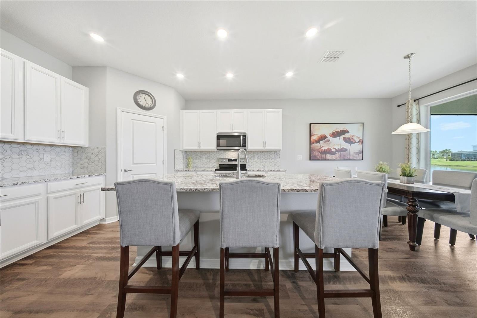Quartz countertops and stylish backsplash
