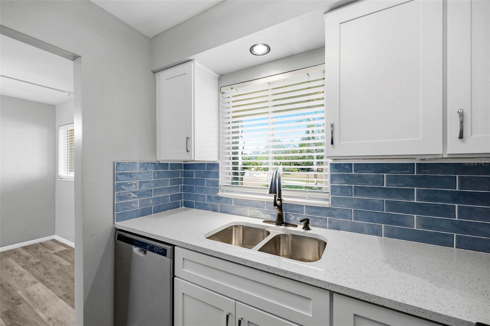 Quartz Counter Tops - Wood Cabinets  - Subway Tile Backsplash