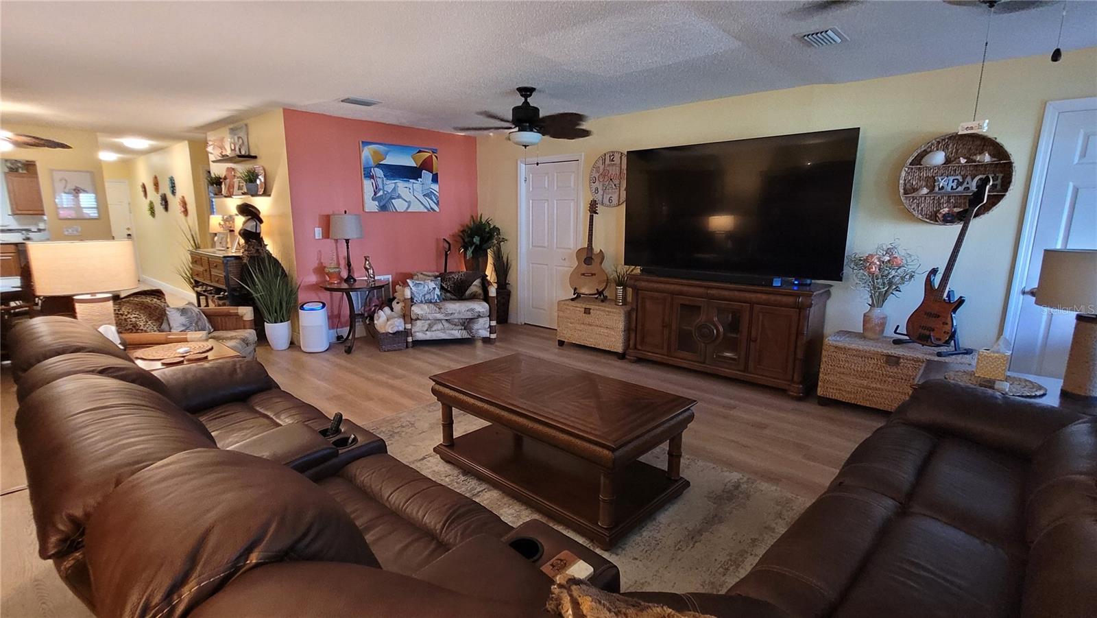 Living room has access to two storage closets