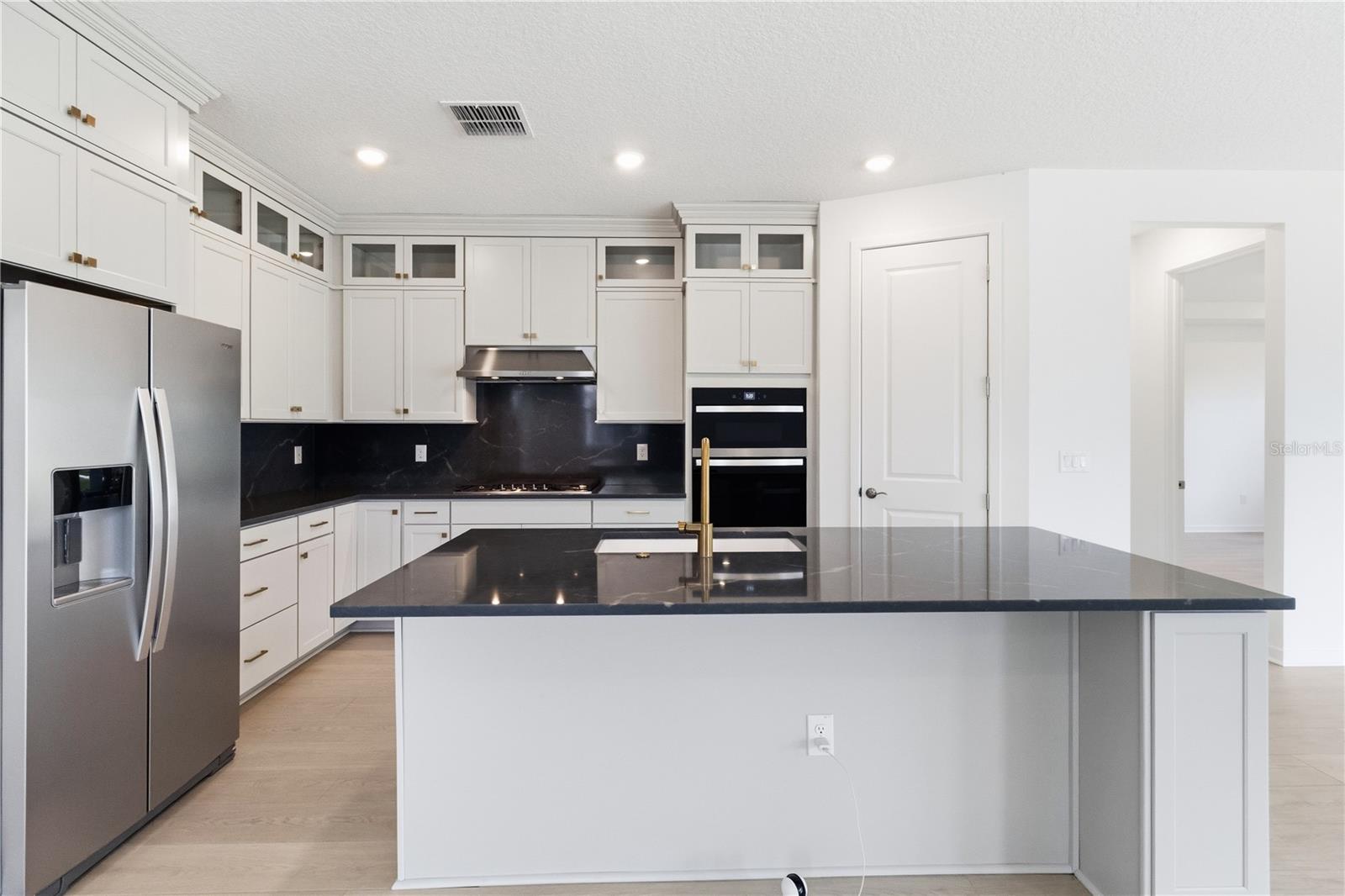 Open kitchen and gathering space designed for meals, conversation, and connection.