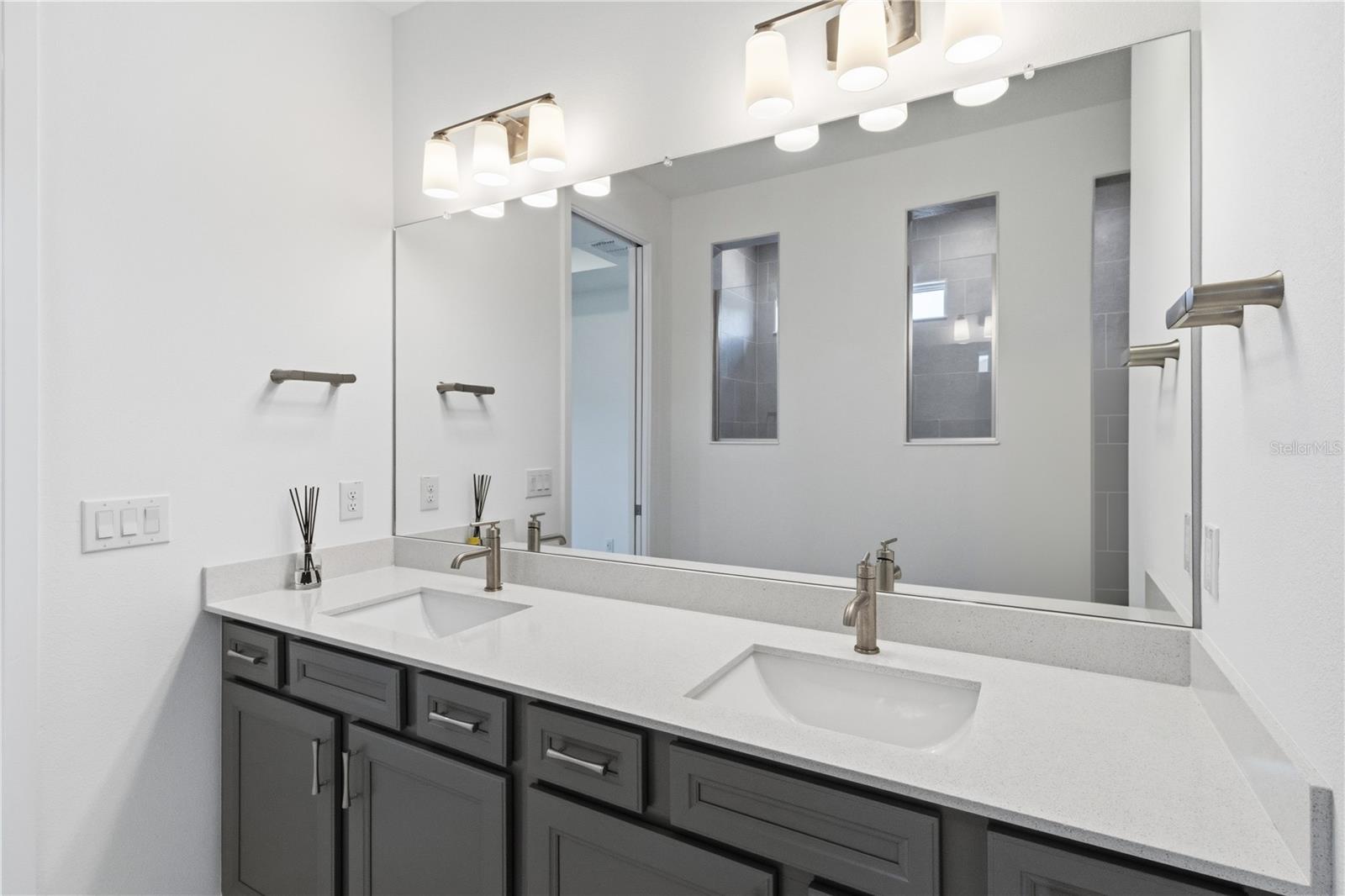 Beautiful primary bath with dual sinks, upgraded finishes, and everyday convenience.