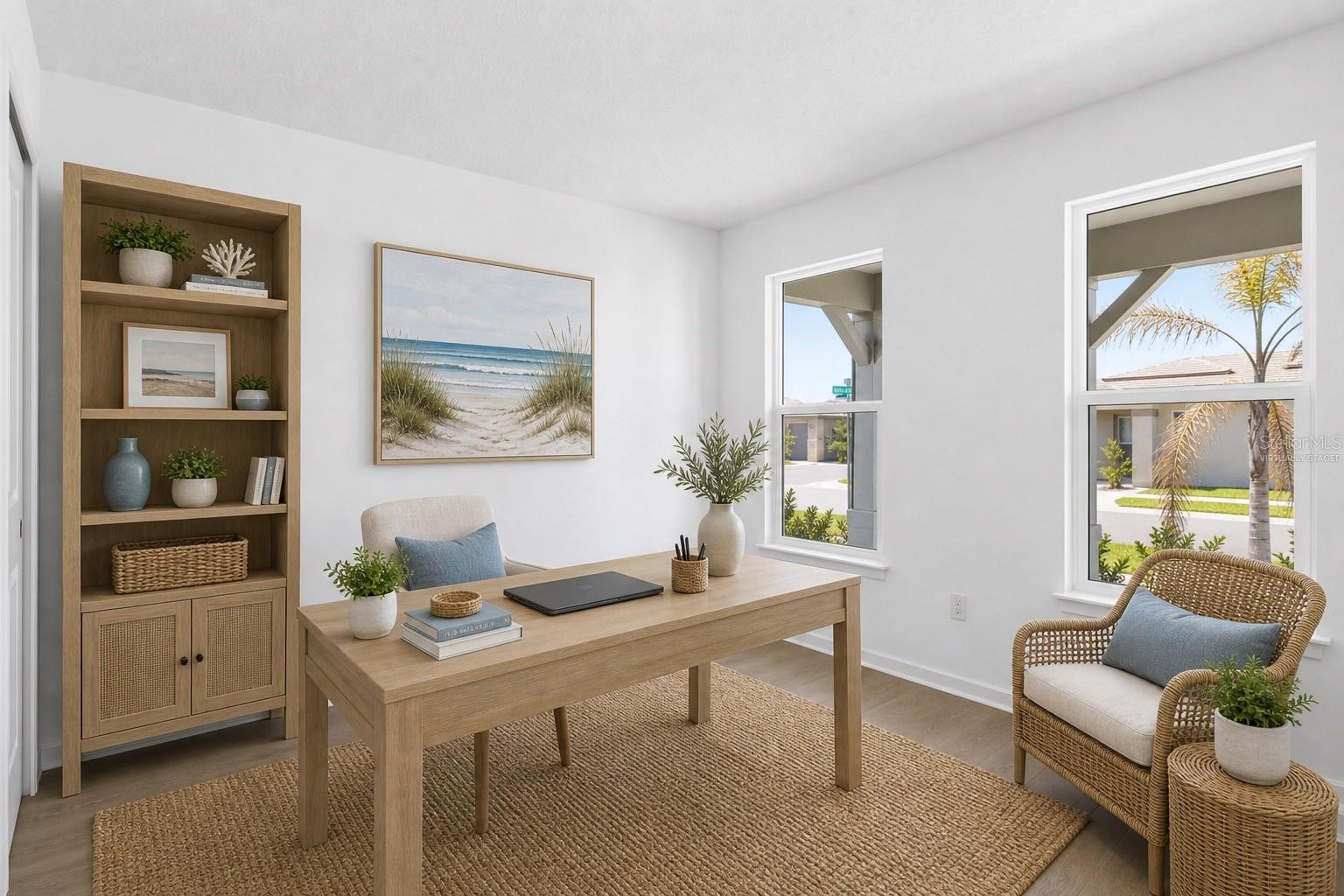Virtually staged first level bedroom can be used as flex space showing how easily this room can live as an office, reading room, or creative retreat.