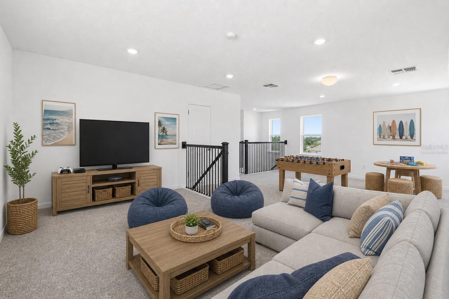 Virtually staged loft showing the perfect setup for movie nights, game days, and casual hangouts.