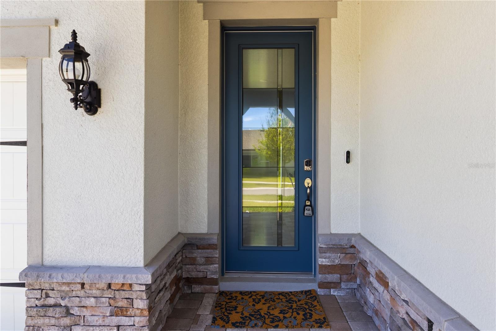 Covered front entry creates a warm first impression before stepping inside.